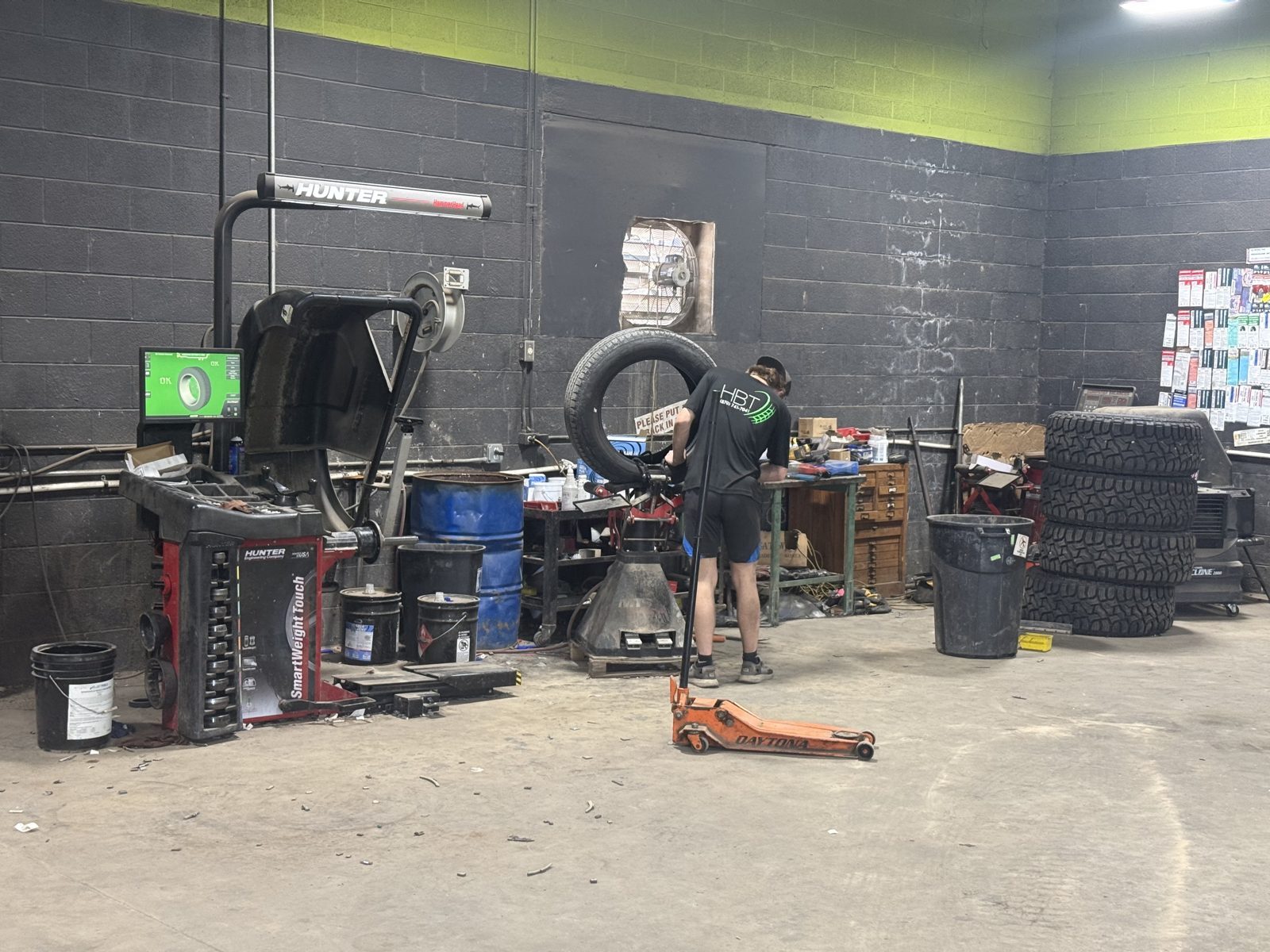 Real work in the bay at Harrison Battery & Tire